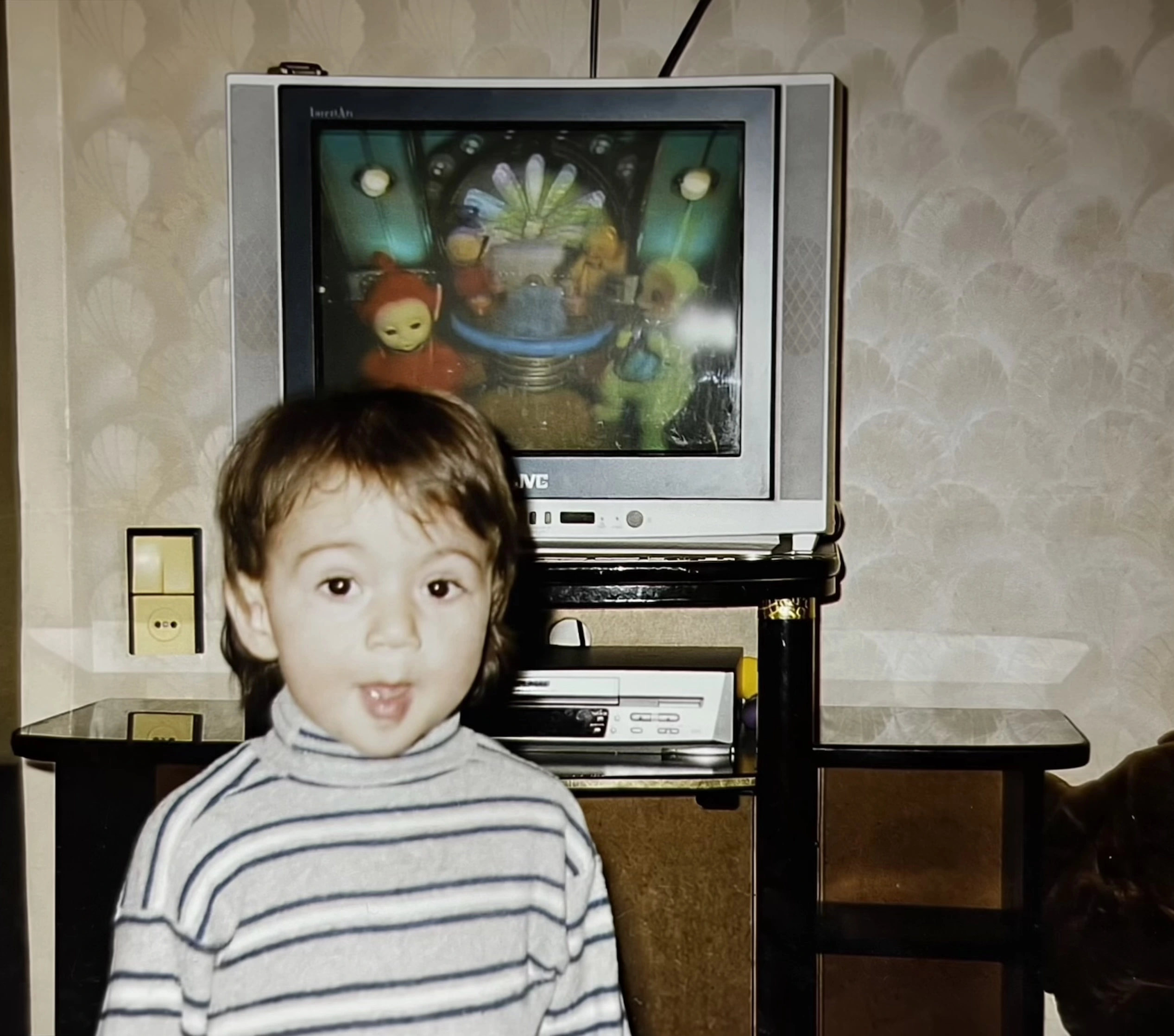 Elmar Ahmadov as a child in front of the Mysterious Television